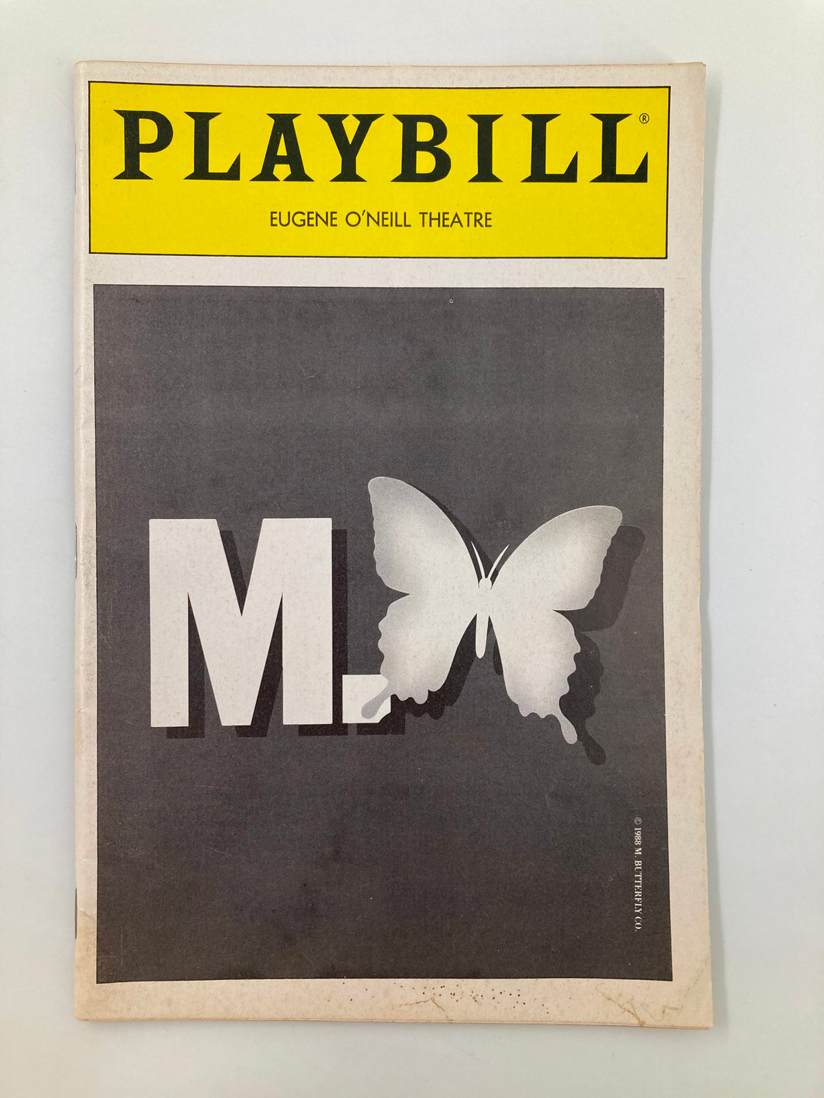 1990 Playbill for M. Butterfly at Eugene O'Neill Theatre featuring a butterfly design and the title M. Butterfly prominently displayed.
