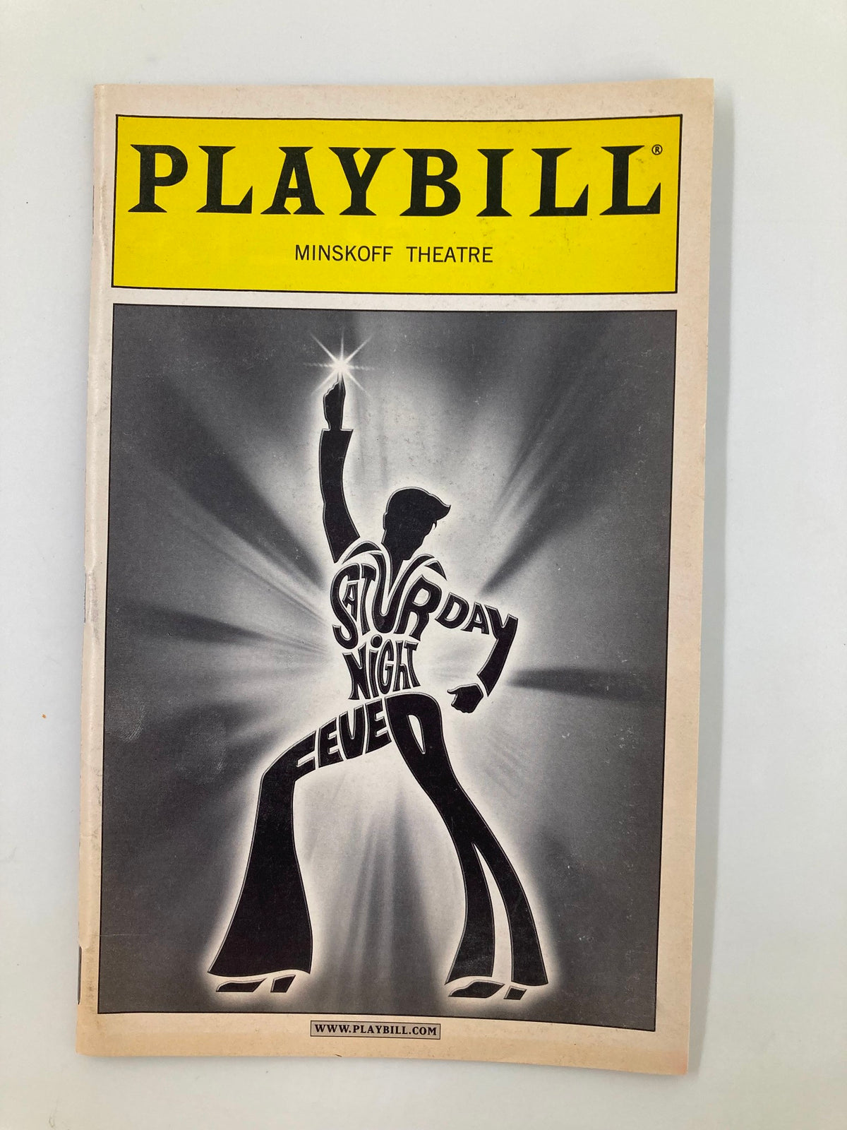 2000 Playbill for Saturday Night Fever at the Minskoff Theatre featuring a striking design of a dancer silhouette.