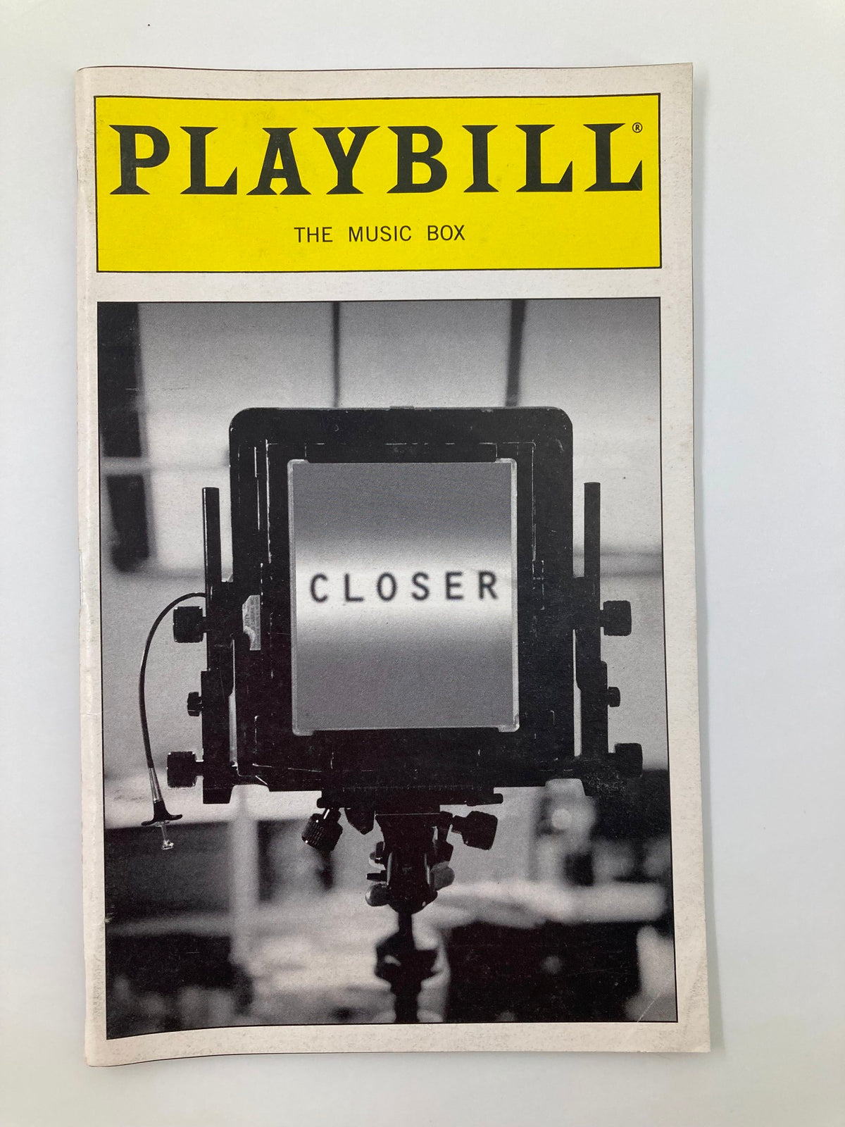 1999 Playbill The Music Box Closer featuring a striking image of the word 'CLOSER' on a film camera backdrop, representing the acclaimed production starring Natasha Richardson and Rupert Graves.
