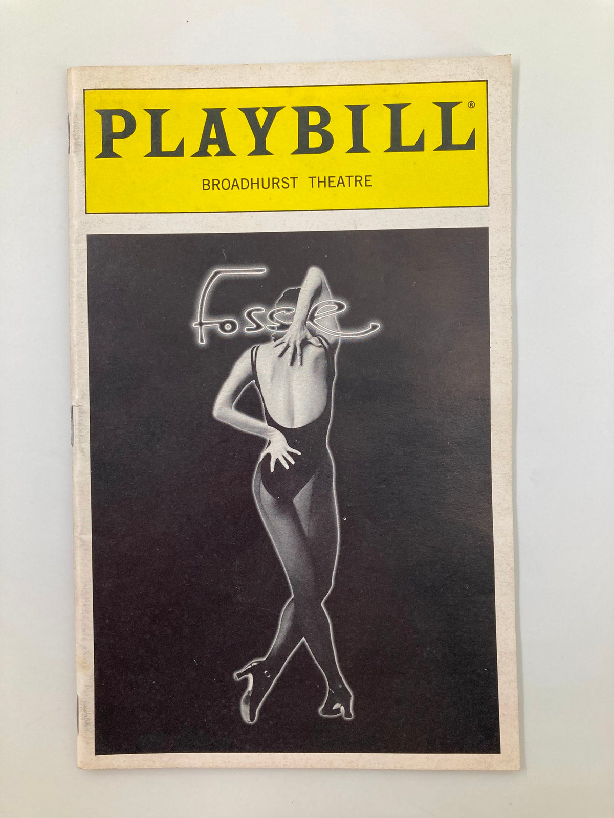 1999 Playbill from the Broadhurst Theatre for the musical Fosse, featuring a striking black and white cover illustration of a dancer.