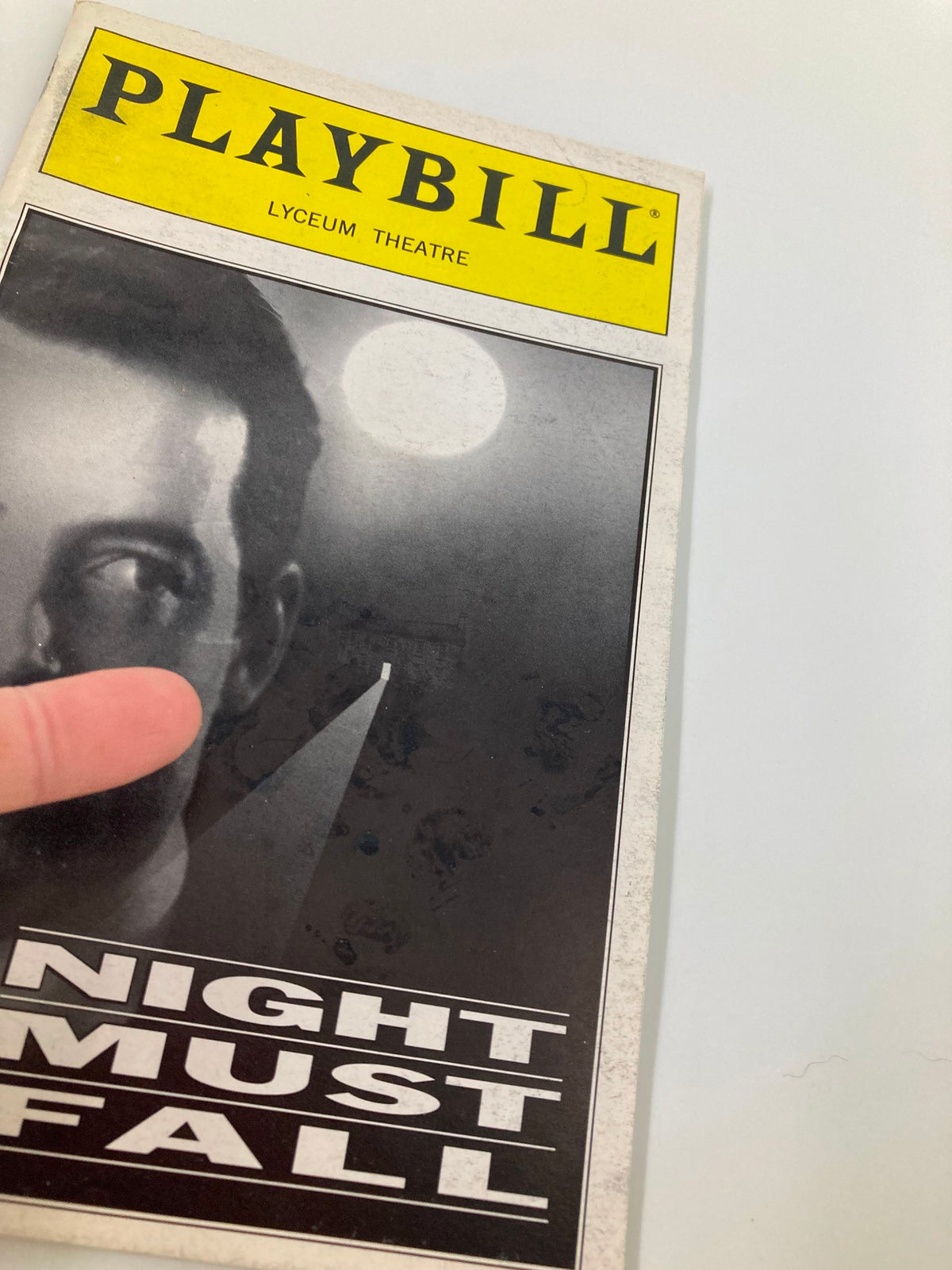 1999 Playbill Lyceum Theatre Night Must Fall showcasing the cover with a close-up of the featured design.