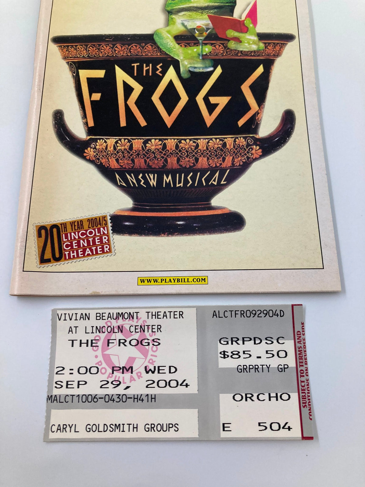 2004 Playbill The Frogs featuring a colorful cover design and a ticket from the performance at Lincoln Center Theater.
