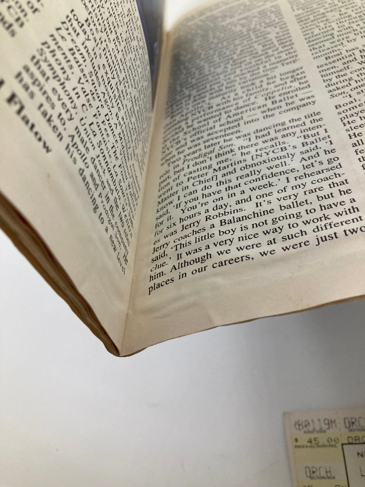 Close-up view of the spine of the 1994 Playbill for Laughter On The 23rd Floor, showing wear and age.