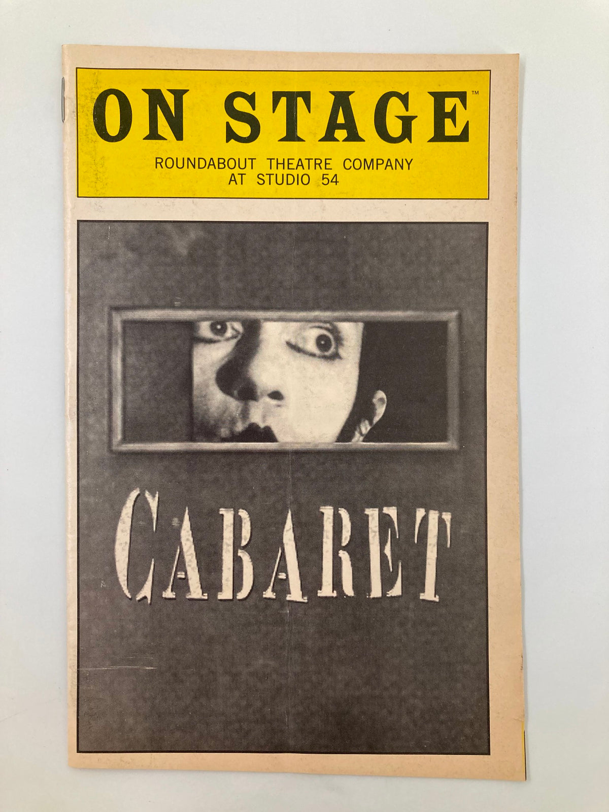 1998 Playbill for 'Cabaret' at Studio 54 by Roundabout Theatre Company, featuring a striking cover image with the title 'CABARET' and a dramatic face peering through a frame.