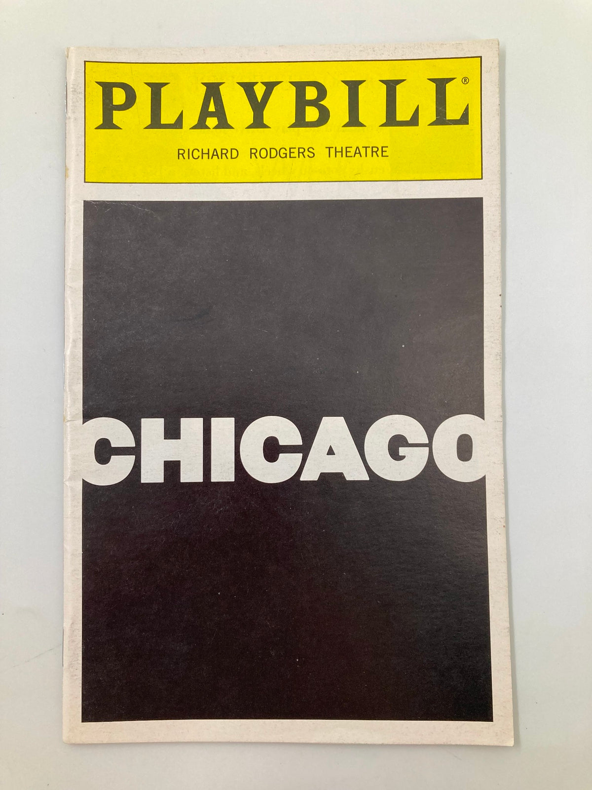 1997 Playbill Richard Rodgers Theatre Chicago featuring a bold black and yellow cover design, showcasing the title 'Chicago' prominently.