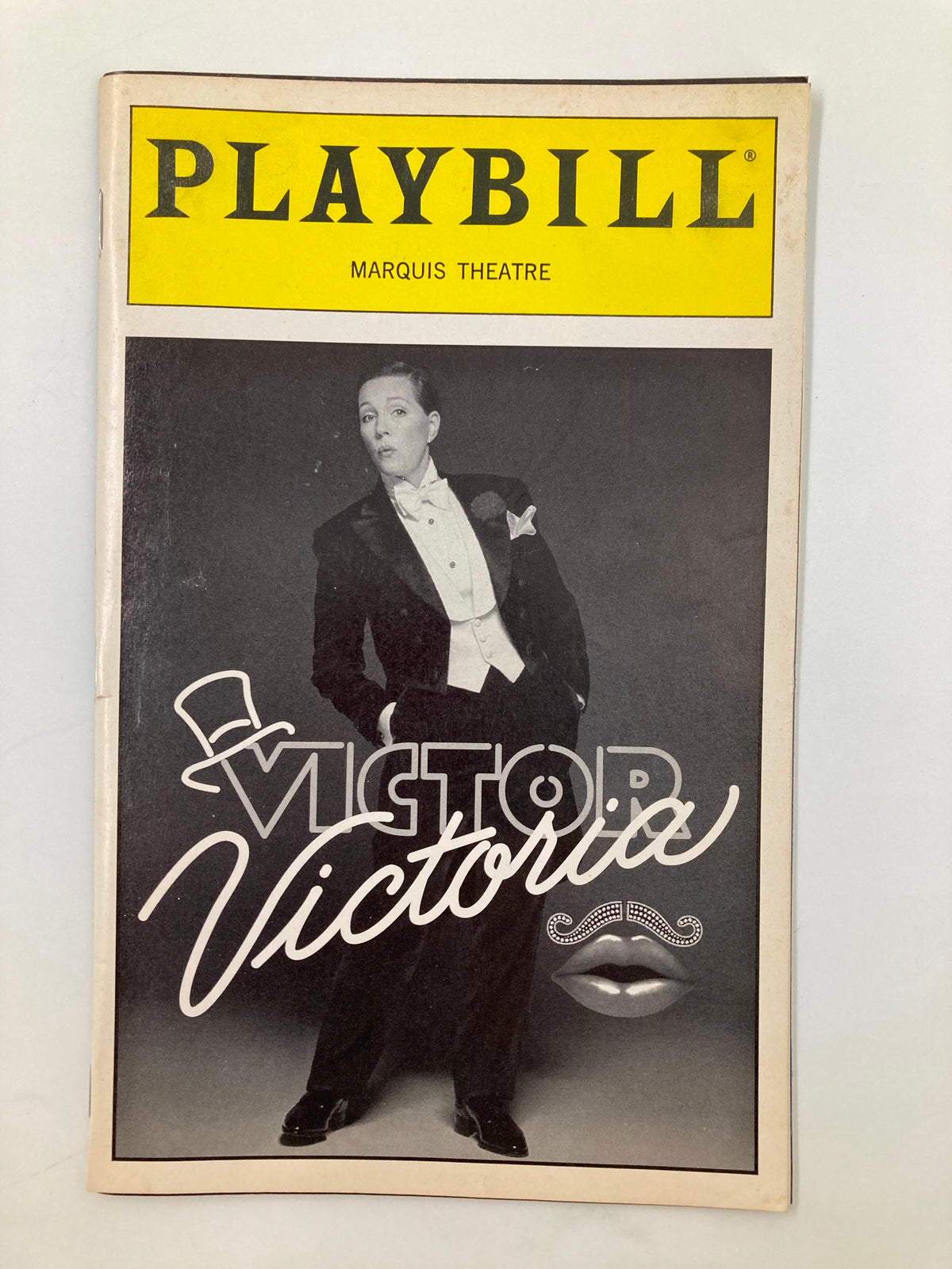 1996 Playbill for the Marquis Theatre production of Victor Victoria, featuring Julie Andrews and Tony Roberts, showcasing a stylish image from the musical performance.