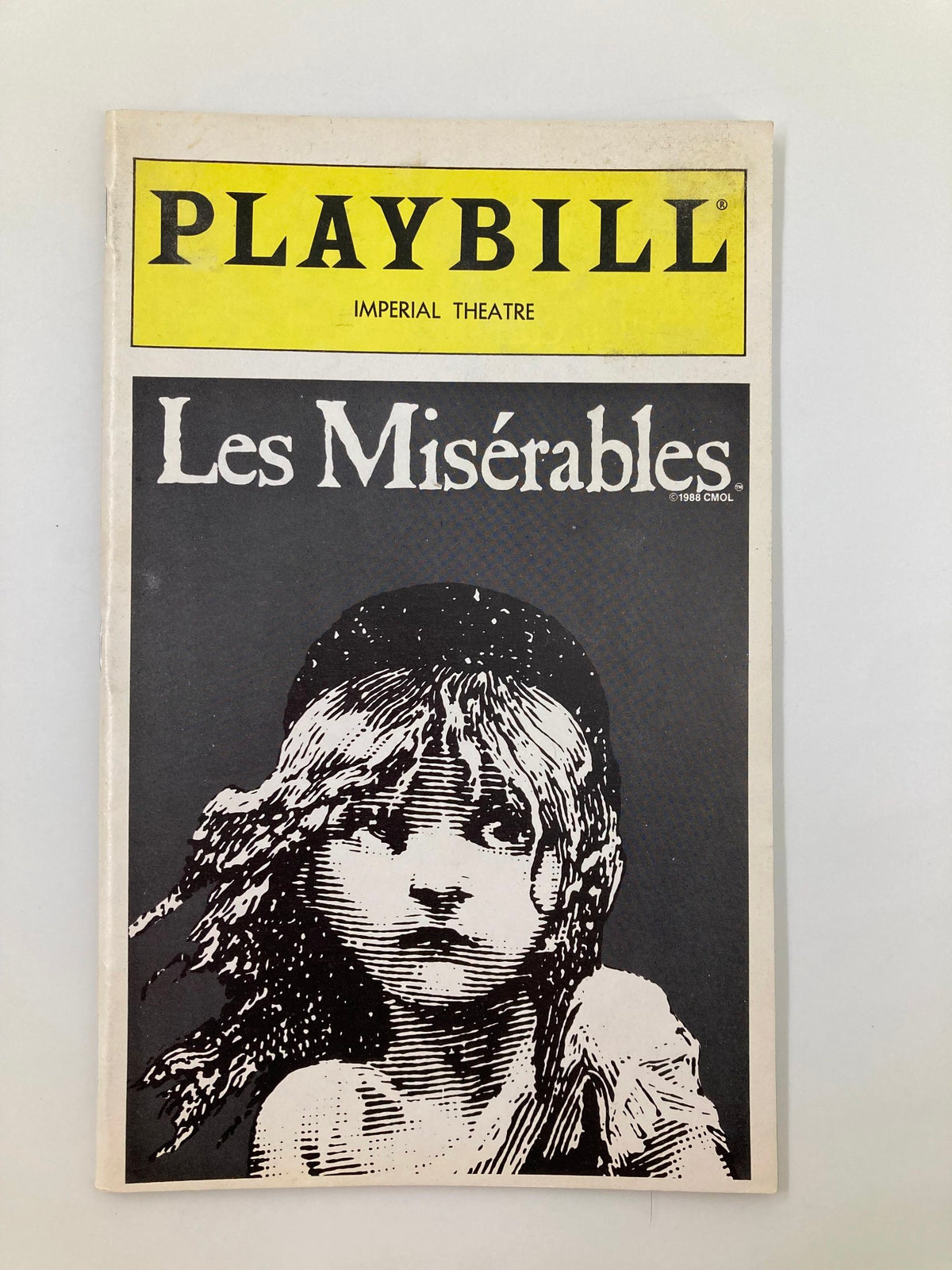 1996 Playbill for Les Miserables at Imperial Theatre, featuring a black and white illustration of a young girl on the cover.