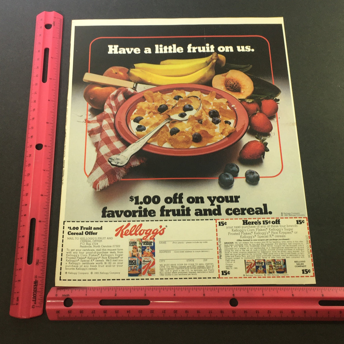 VTG 1981 Kellogg's Corn Flakes, Sugar Frosted Flakes Fruit & Cereal Offer Coupon advertisement showcasing a bowl of cereal and fruits, with a visible ruler for size reference, depicting a $1.00 discount offer.
