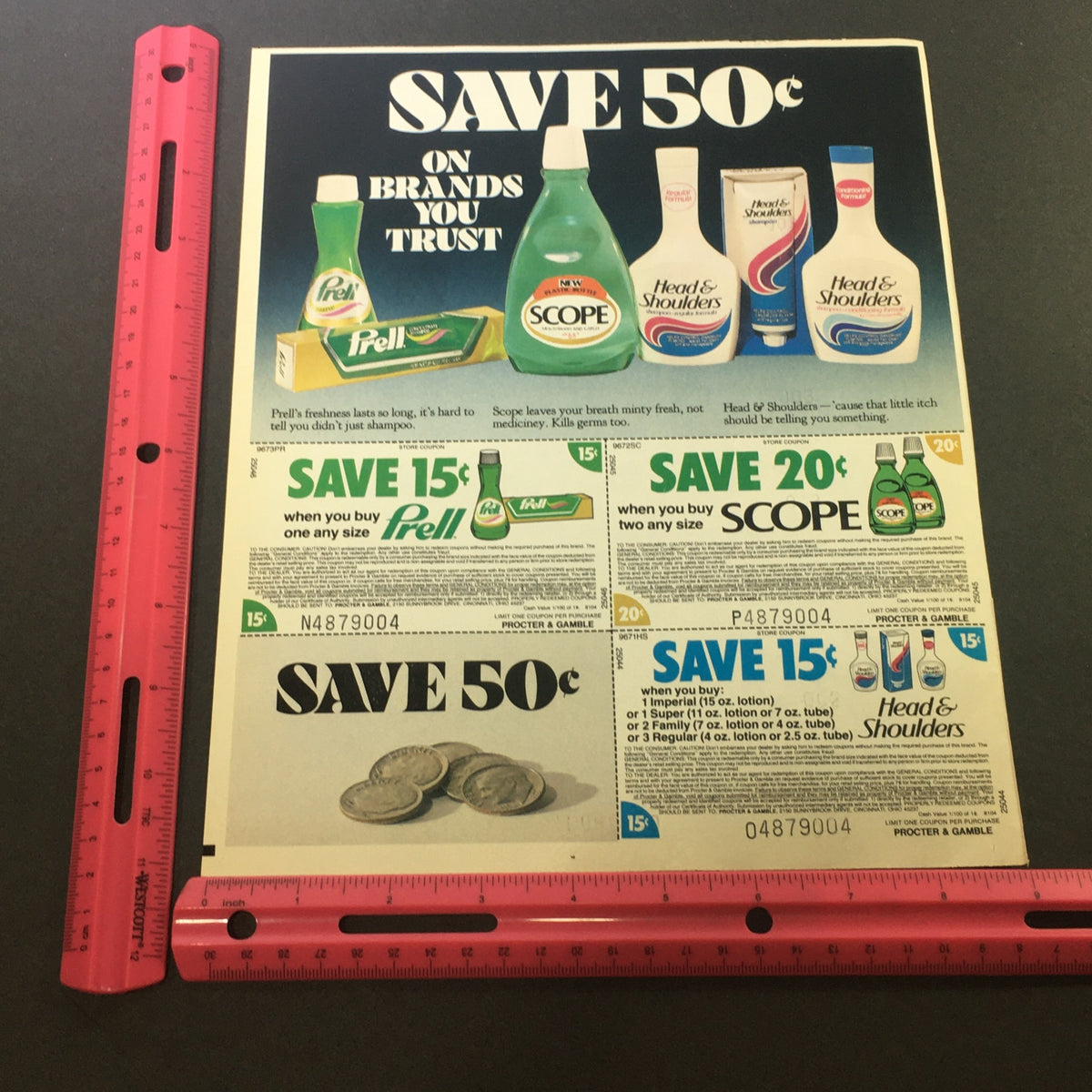 VTG 1981 Prell Shampoo, Scope Mouthwash & Head & Shoulder's Shampoo Ad Coupon displayed next to a ruler for size reference. The ad includes various savings offers on well-known hair and mouthcare brands.