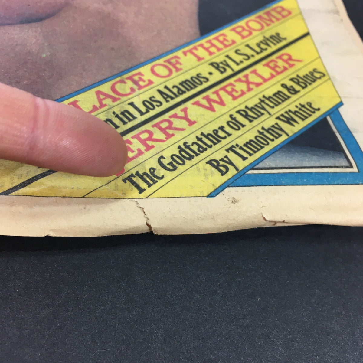 Detail shot of the bottom corner of VTG Rolling Stone Magazine November 27, 1980, showcasing the magazine's condition with visible wear and creases.