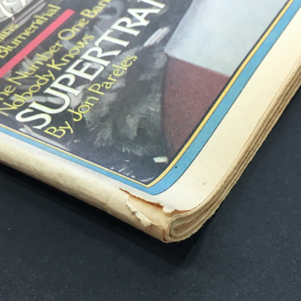 Detailed view of the spine of the VTG Rolling Stone Magazine July 12 1979, highlighting minor damage and the vintage magazine's character.
