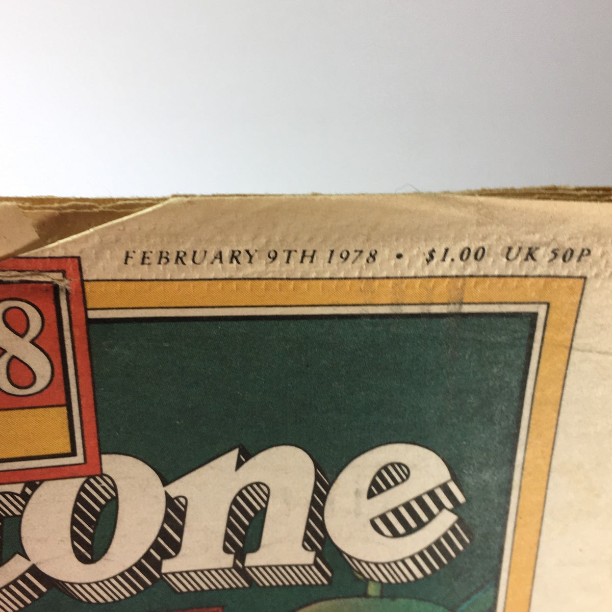 Top view of the vintage Rolling Stone Magazine from February 9, 1978, displaying the date and price, emphasizing its significance as a piece of history.