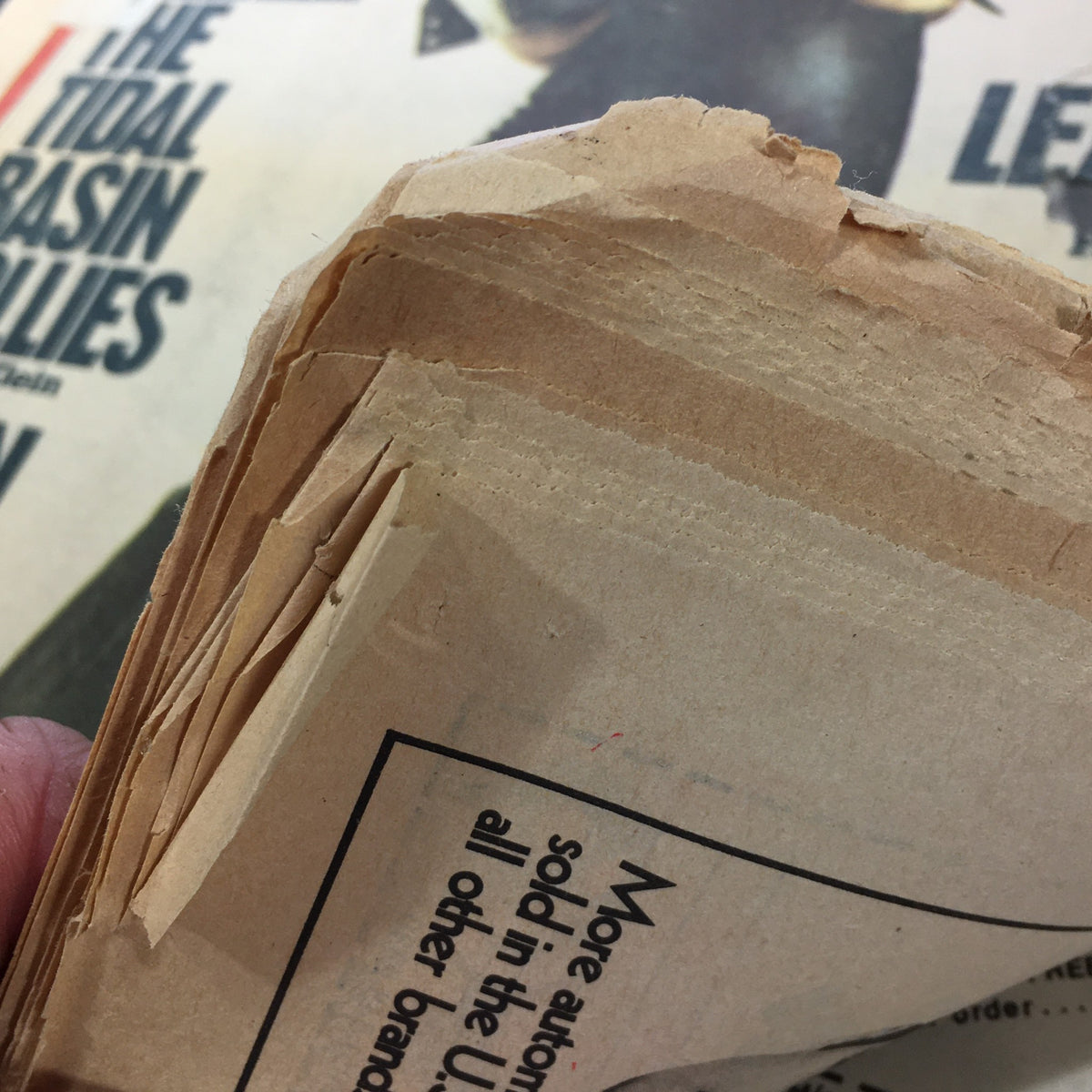 Detail shot of the vintage Rolling Stone magazine January 2, 1975, displaying the frayed pages, indicative of its classic history and wear.
