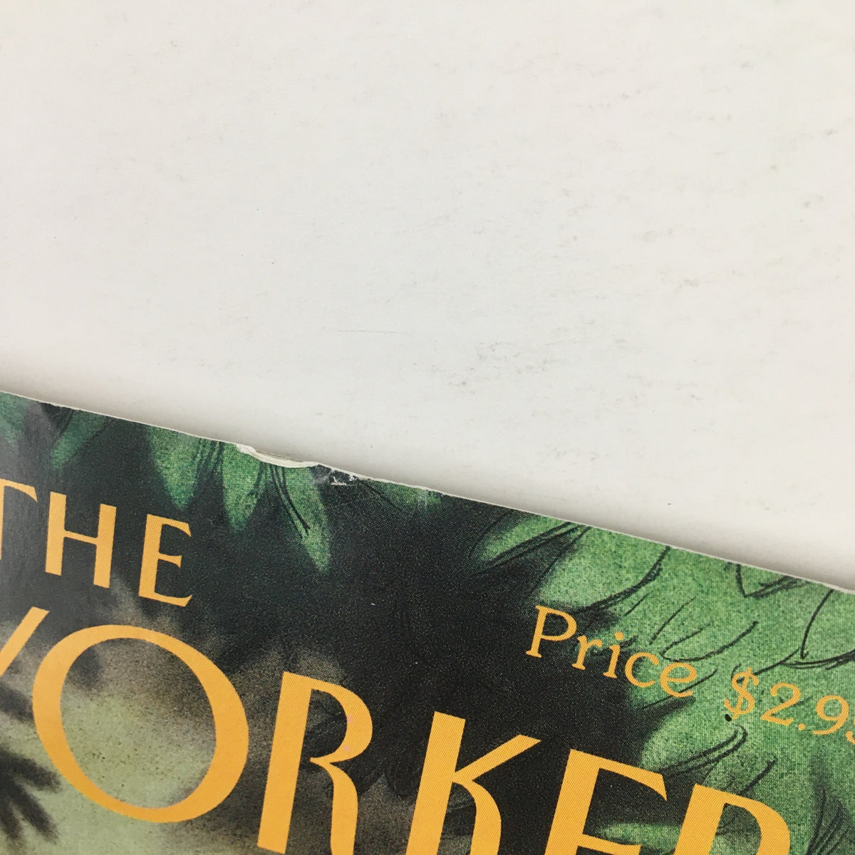 Detail of the corner of The New Yorker September 16 1996 cover showing minor wear and the magazine's title and price.