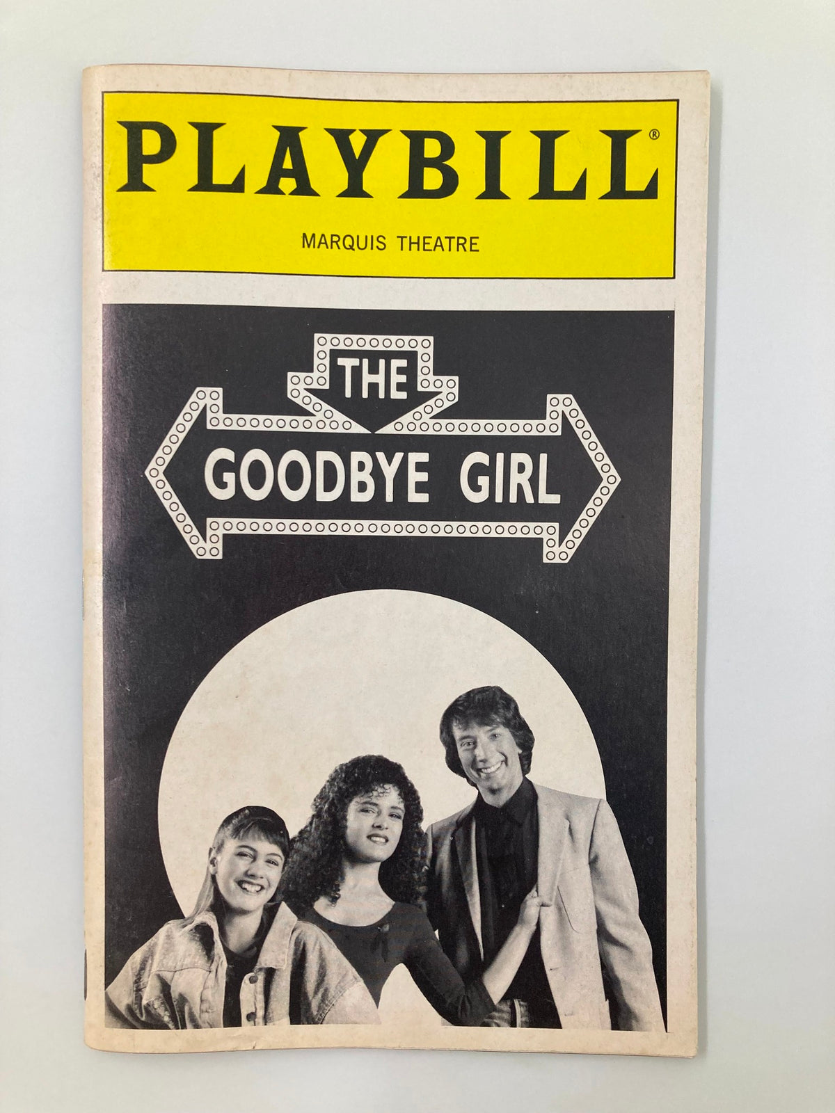 1993 Playbill for 'The Goodbye Girl' at Marquis Theatre featuring prominent stars. The cover displays the show's title and photographs of three actors, symbolizing the production's charm and theatrical essence.