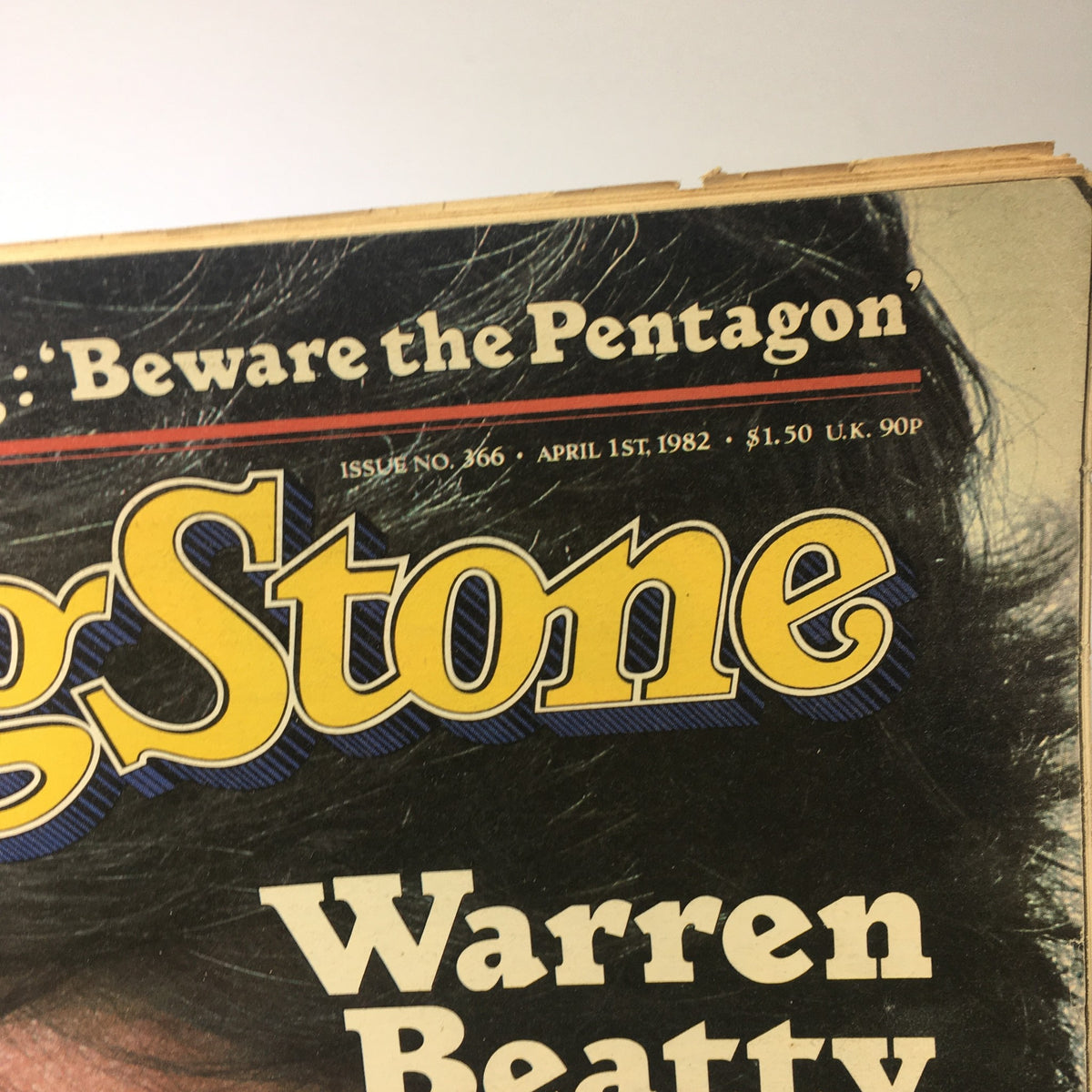 Close-up of the April 1, 1982 issue of Rolling Stone magazine, featuring bold lettering and the title 'Warren Beatty'. This vintage magazine highlights music and film culture from the early 80s.