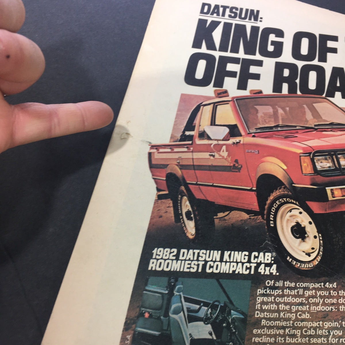 Detail of the back cover of the April 1, 1982 issue of Rolling Stone magazine, showcasing an advertisement for the 1982 Datsun King Cab truck, emphasizing its status as the roomiest compact 4x4.