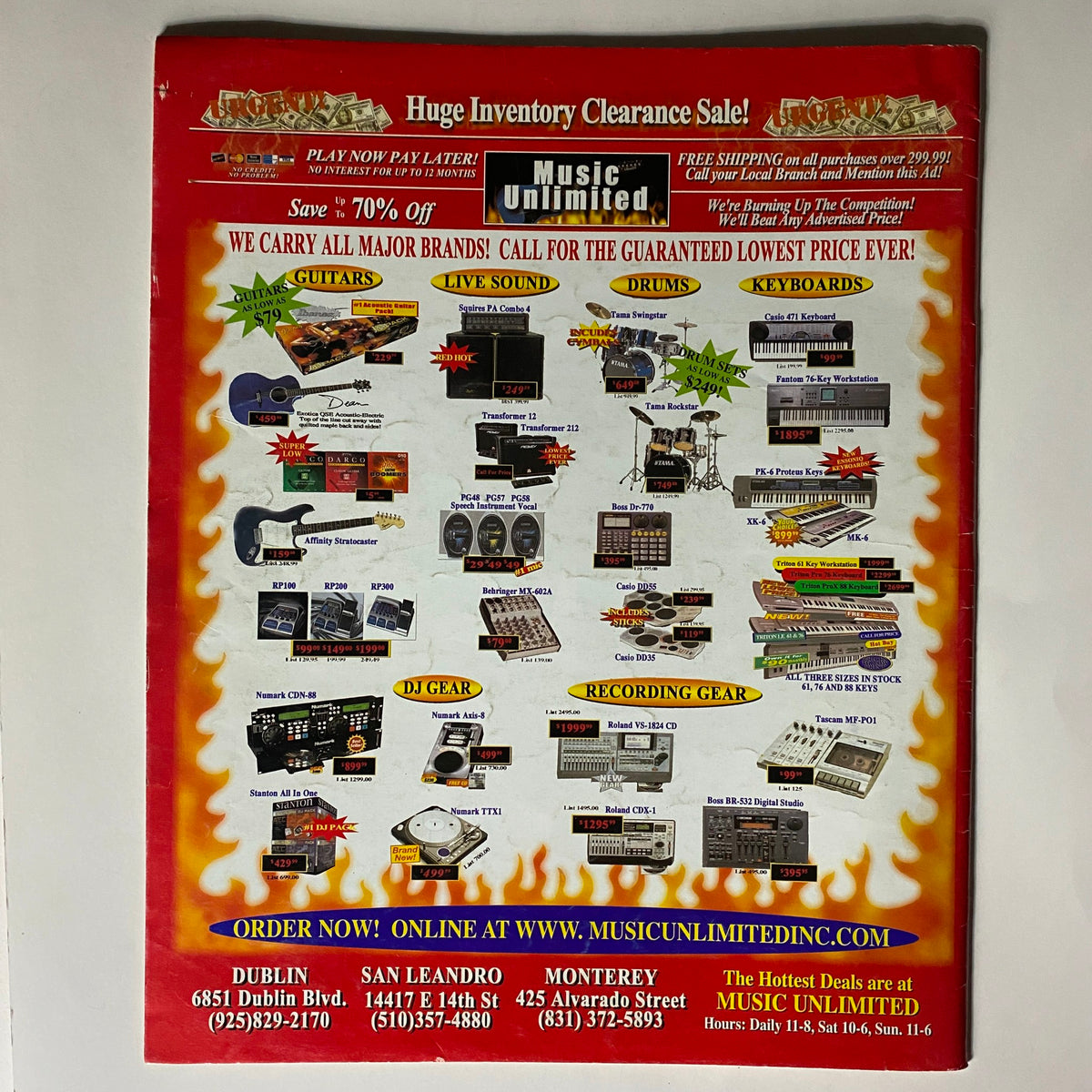 Back cover of Zero Magazine July-August 2002 displaying a clearance sale advertisement from Music Unlimited, featuring various musical instruments and equipment.