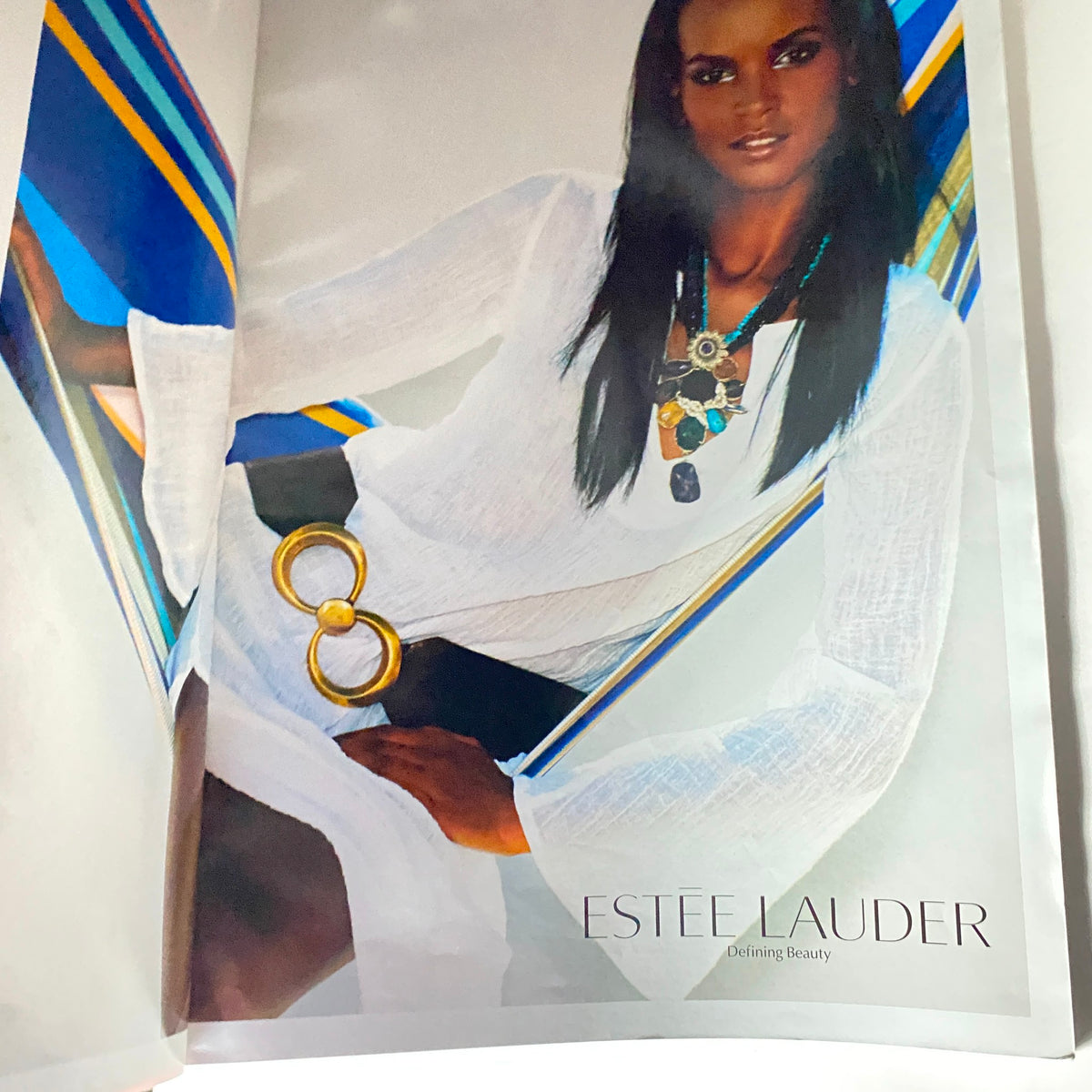 Inside page of V Magazine Summer 2005 No. 35 featuring an Estee Lauder advertisement with a model in a white outfit, highlighting beauty and fashion trends of the time.