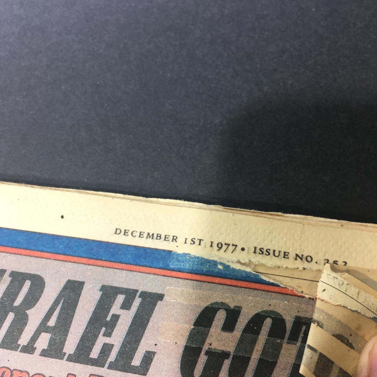 Close-up of the top border from the Rolling Stone Magazine December 1, 1977, displaying publication date and issue number.