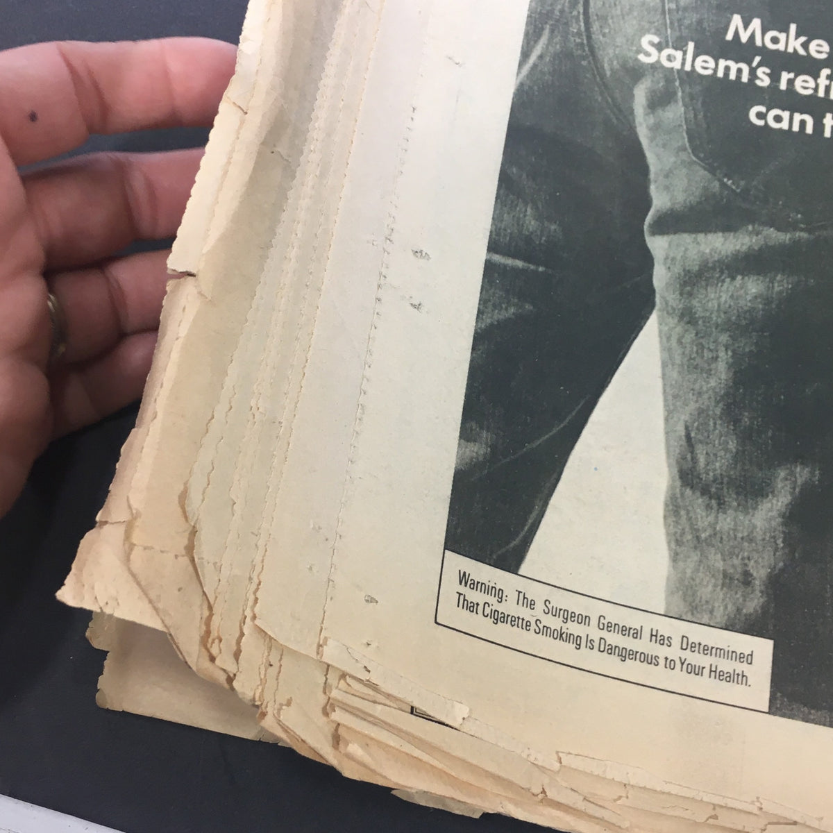 Interior page of Vintage Rolling Stone Magazine from March 27, 1975, showing multiple worn pages and a cigarette warning.