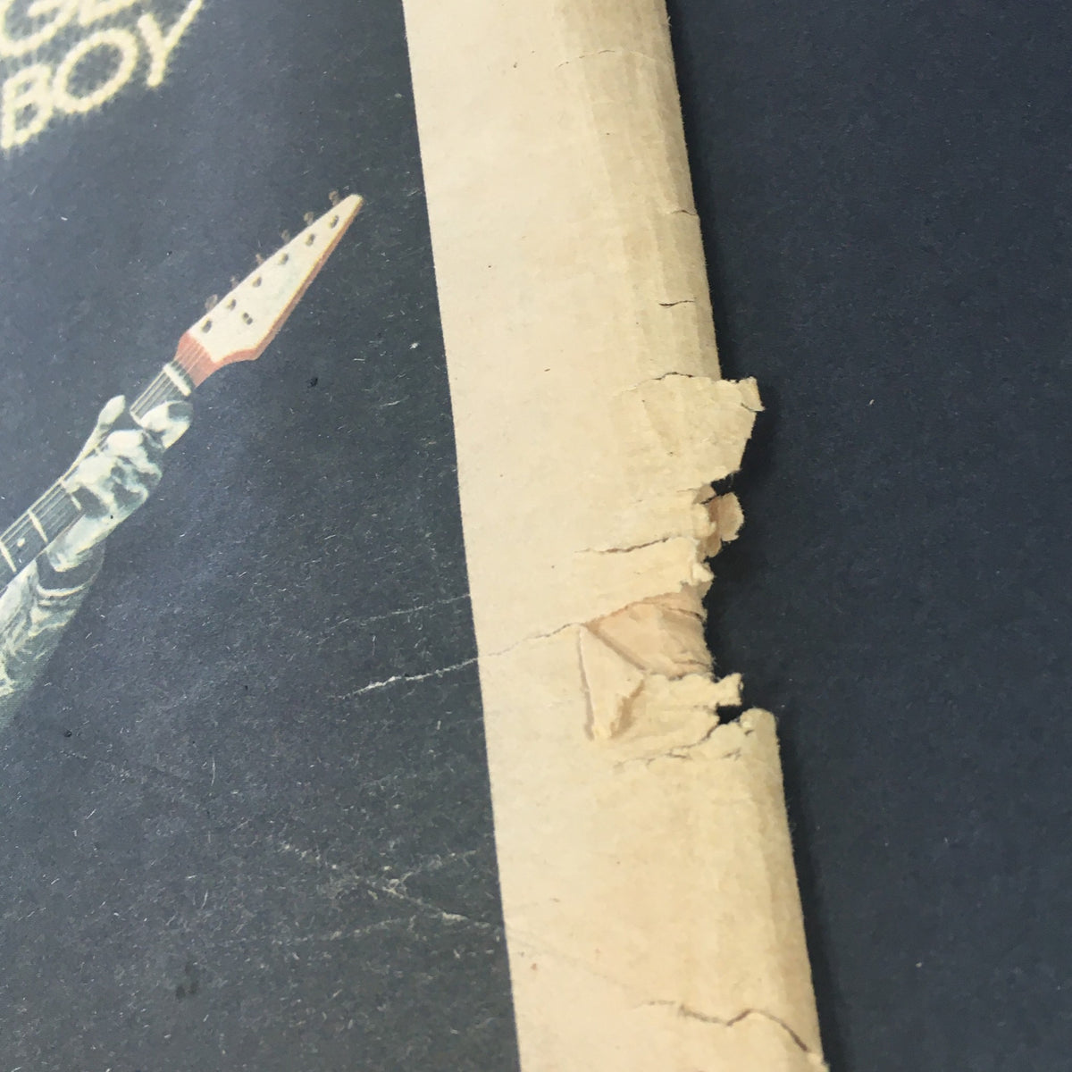 Side view of VTG Rolling Stone Magazine May 23 1974 displaying a damaged edge, showcasing its authentic vintage condition and collectibility.
