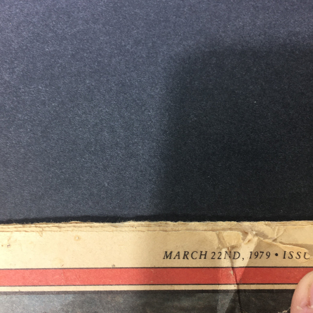 Close-up view of the bottom edge of the VTG Rolling Stone Magazine March 22 1979, highlighting the date and signs of aging, reflecting its vintage charm.