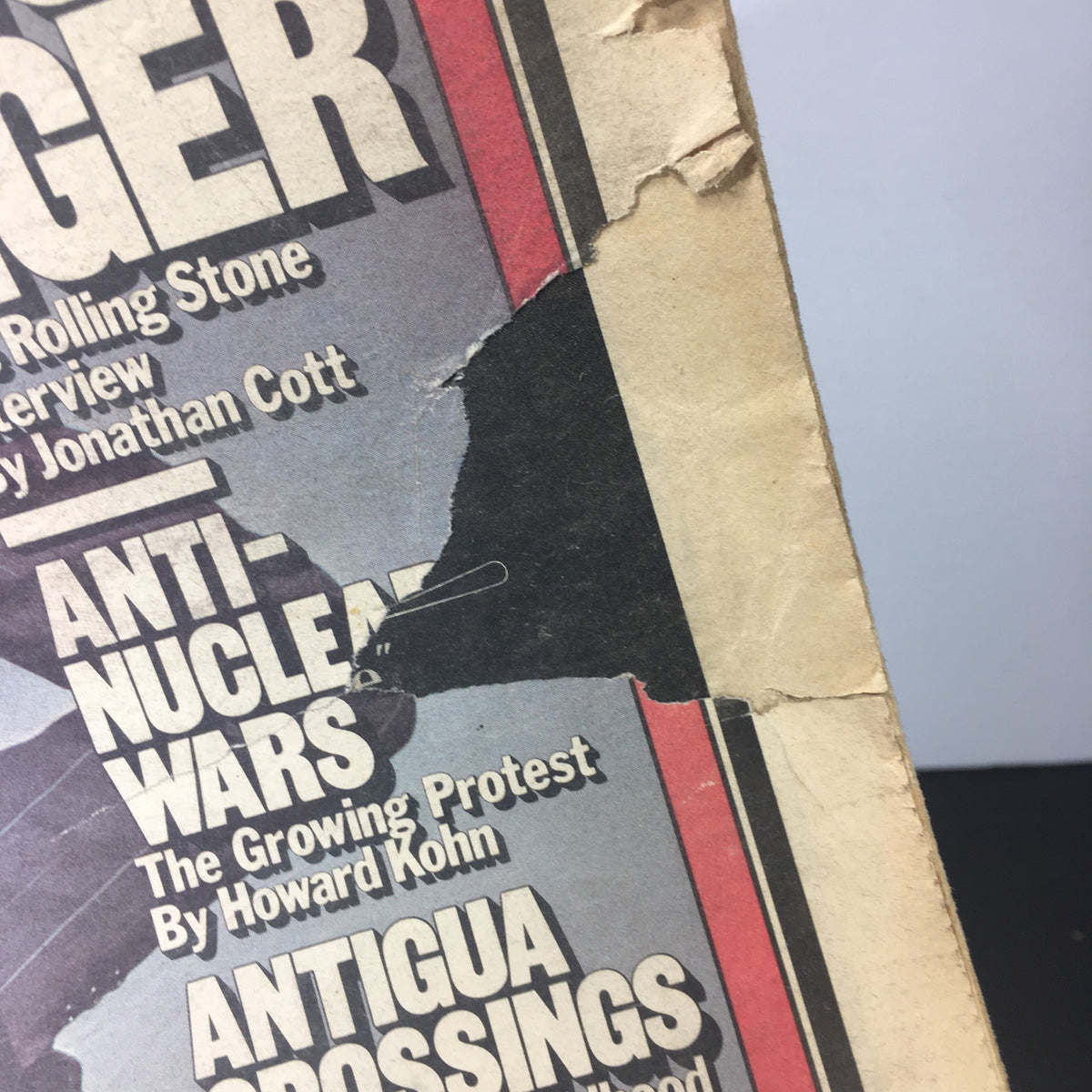 Side view of the vintage Rolling Stone Magazine from June 29, 1978, showcasing notable damage including tears and a mark, emphasizing its vintage character.