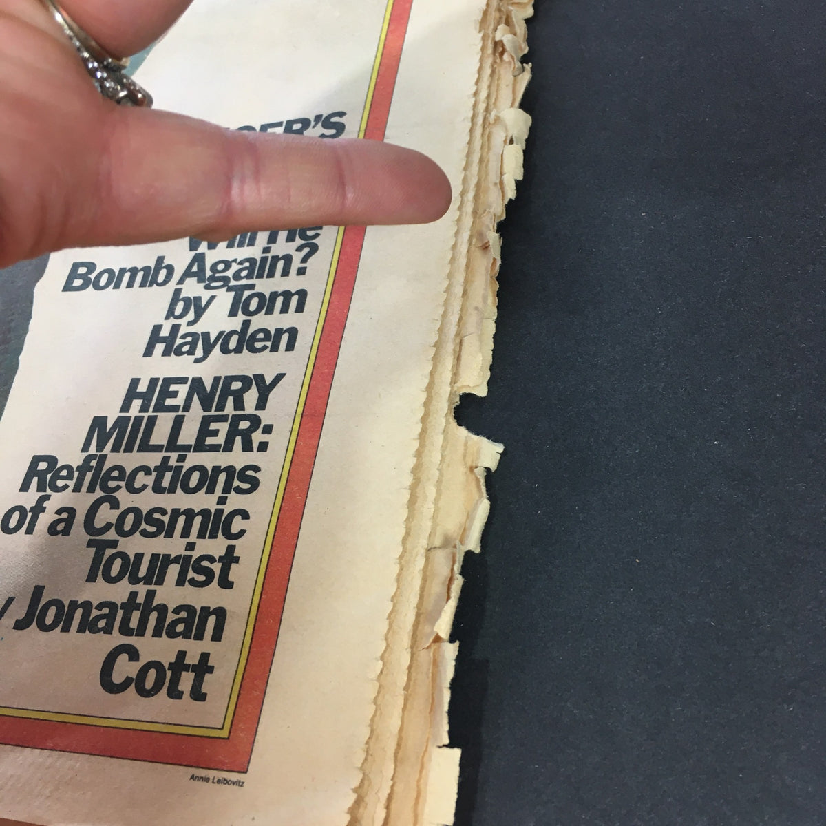 Detail of a vintage Rolling Stone magazine page, showcasing the edge wear and small tears, highlighting the magazine's collectible nature from February 27, 1975.
