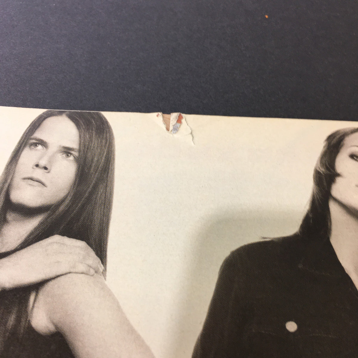 Close-up of an inside page from VTG Rolling Stone Magazine December 14 1995 featuring a Calvin Klein advertisement, showcasing models in 90s fashion with minor wear visible on the paper.