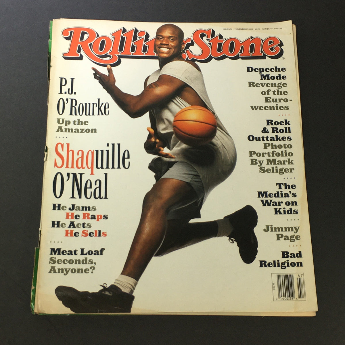 Cover of Rolling Stone Magazine from November 25, 1993, featuring NBA star Shaquille O'Neal, showcasing him in a dynamic pose with a basketball. The headline includes P.J. O'Rourke.