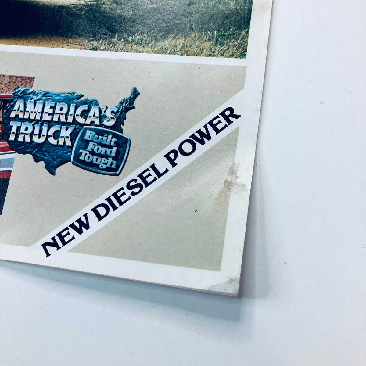Close-up view of the '83 Ford F-Series Pickup Dealer Showroom Sales Brochure highlighting the text 'New Diesel Power' and a map of America, promoting the truck's features.