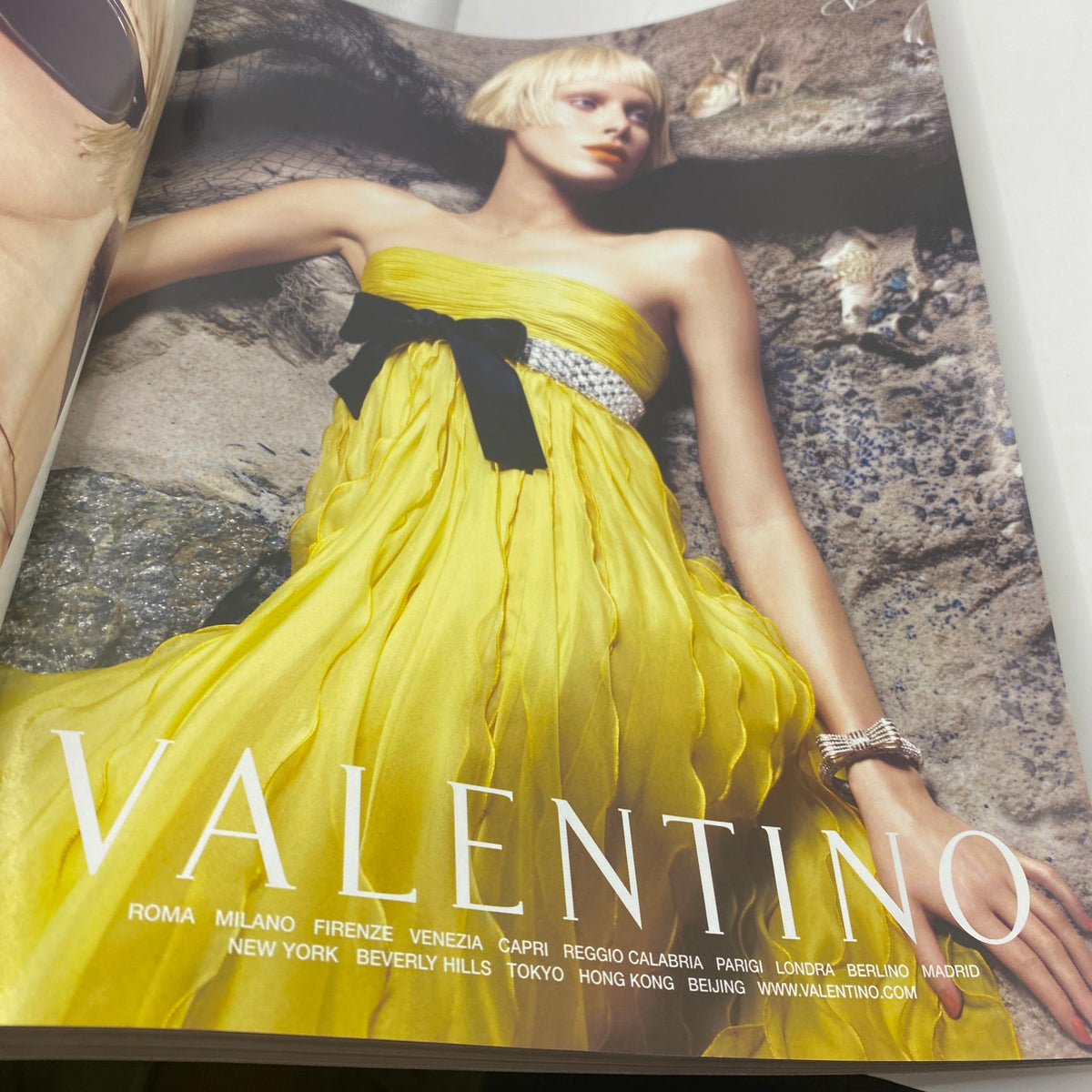 Marie Claire Italy Magazine April 2007 Bianca Balti Cover displaying a striking advertisement for Valentino, featuring a model in a vibrant yellow dress against a natural backdrop.