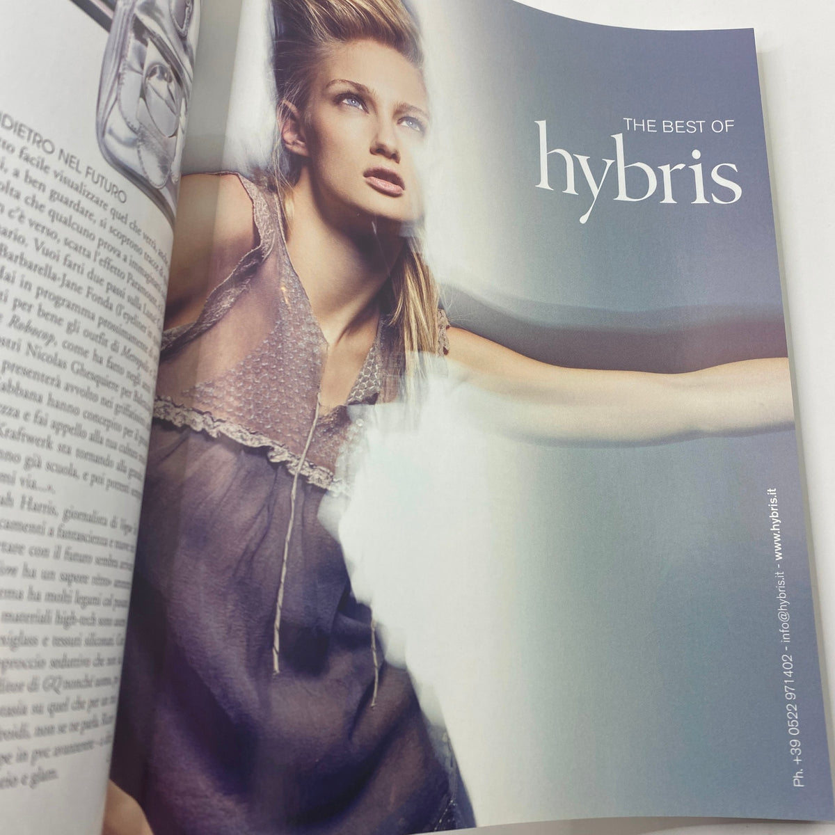 Marie Claire Italy Magazine April 2007 Bianca Balti Cover highlighting an advertisement for hybris, featuring a model in a chic gray outfit illuminated by soft lighting.