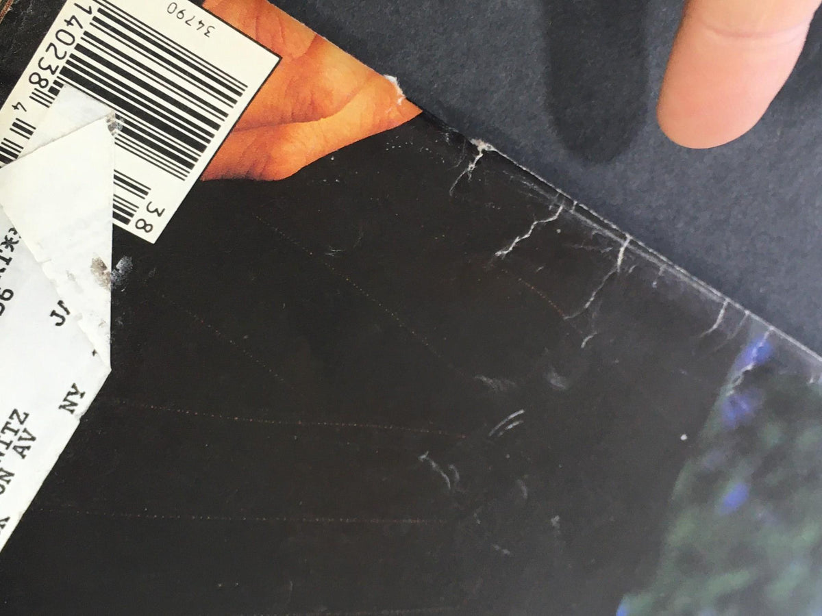 Close-up of the cover edge of the Vintage Rolling Stone Magazine September 17, 1992, highlighting details like wear and address label.
