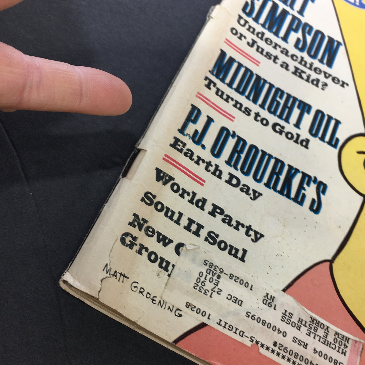Close-up of VTG Rolling Stone Magazine June 28 1990 showing details on articles including Bart Simpson and P.J. O'Rourke, with visible wear typical of vintage magazines.