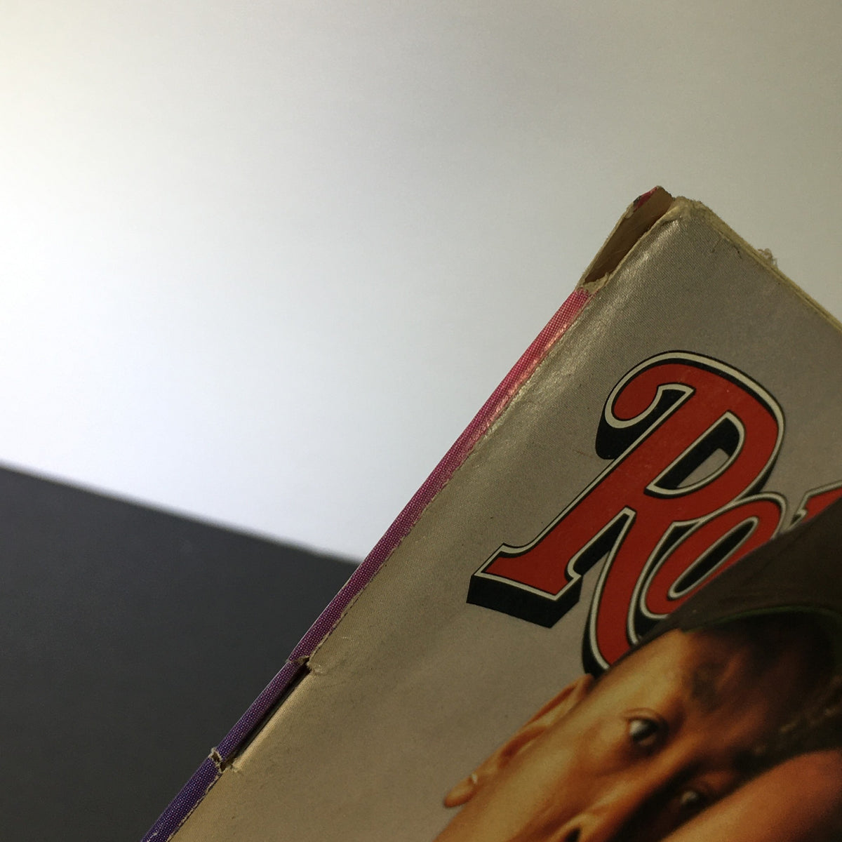 Close-up view of the spine and edge of the VTG Rolling Stone Magazine from September 30, 1993 featuring Dr. Dre and Snoop Dogg, showcasing its vintage condition.