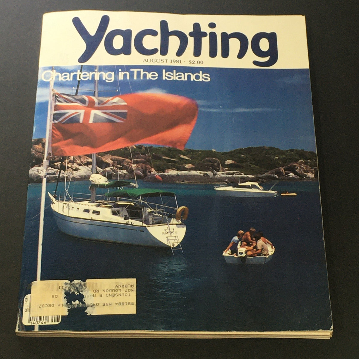 Cover of the Vintage Yachting Magazine from August 1981, featuring the article 'Chartering The Islands' with a scenic background of a sailboat and a picturesque ocean view.