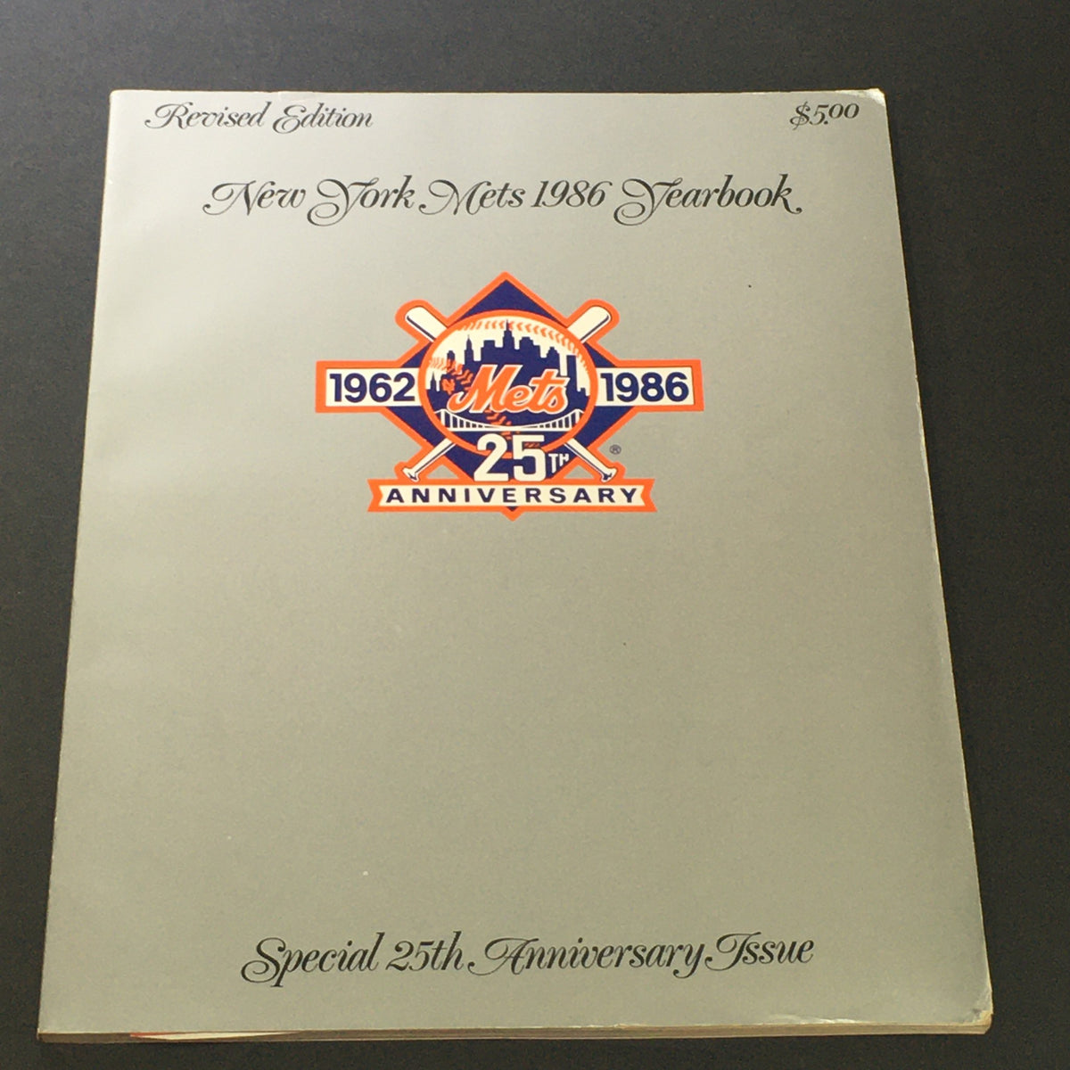 Cover of the VTG New York Mets Official Yearbook 1986 Revised Edition 25th Anniversary Issue featuring the Mets logo and anniversary details.