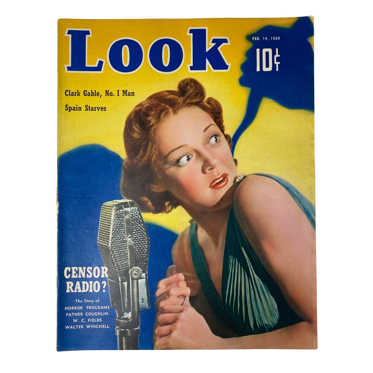 Cover of Look Magazine dated February 14, 1939, featuring a striking illustration of a woman with red hair and a microphone, highlighting Clark Gable and Spain's plight with the headline 'Censor Radio?'.