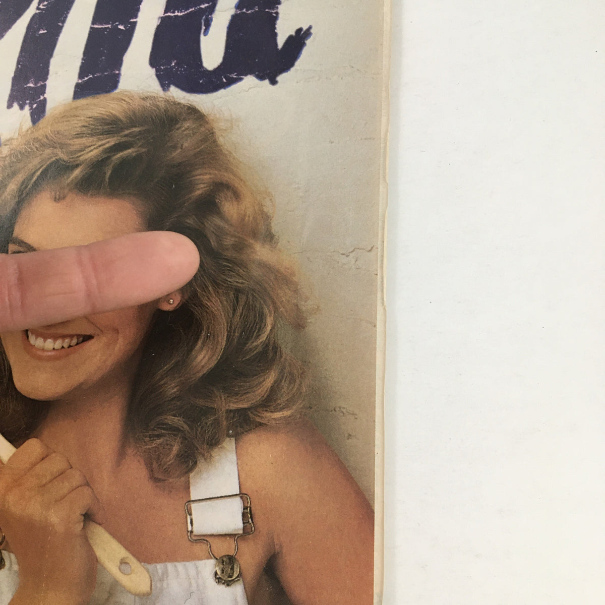 1988 Textra Shampoo & Conditioner Circular Coupon Advertisement showing a woman with wavy hair smiling and holding a hair styling tool. The image captures the essence of the advertisement promoting hair care products.