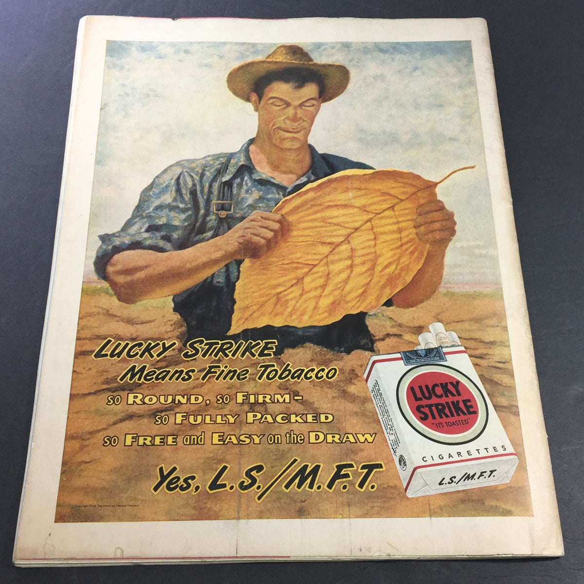 Cover illustration for Lucky Strike cigarettes in VTG Collier's Magazine February 16, 1946, depicting a farmer inspecting a large tobacco leaf in a vibrant outdoor setting.