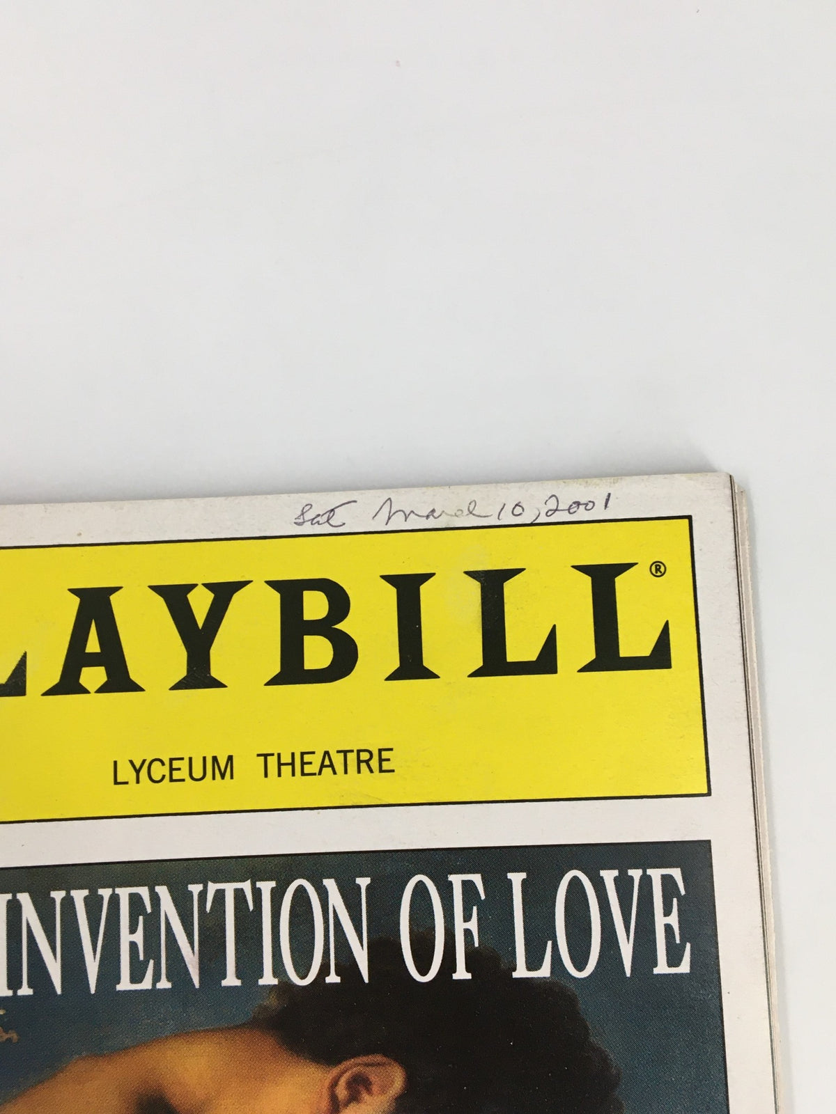 Close-up of the 2001 Playbill for 'The Invention of Love,' showing an inscription dated March 10, 2001.