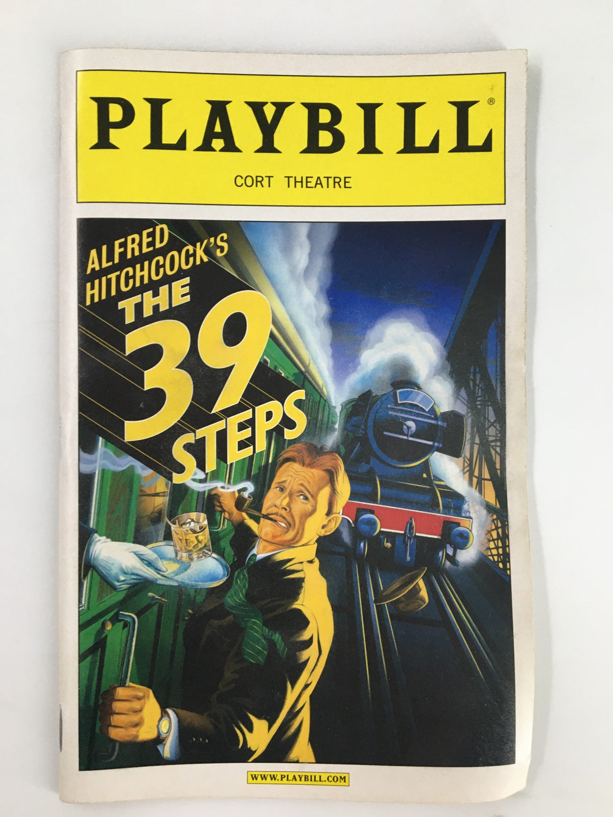 2008 Playbill featuring Arnie Burton in Alfred Hitchcock's The 39 Steps at the Cort Theatre, showcasing vibrant artwork of a train and suspenseful scene.