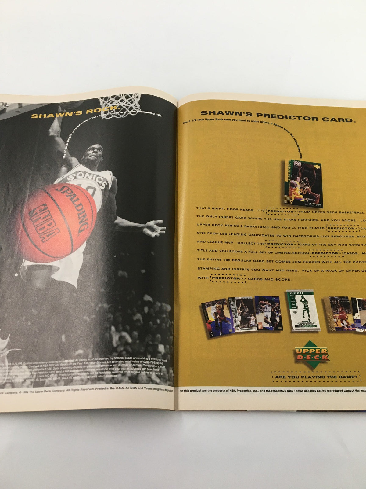 Double-page spread from Wesley Person Beckett Basketball #57 April 1995 presenting a player dunking a basketball with promotional content.