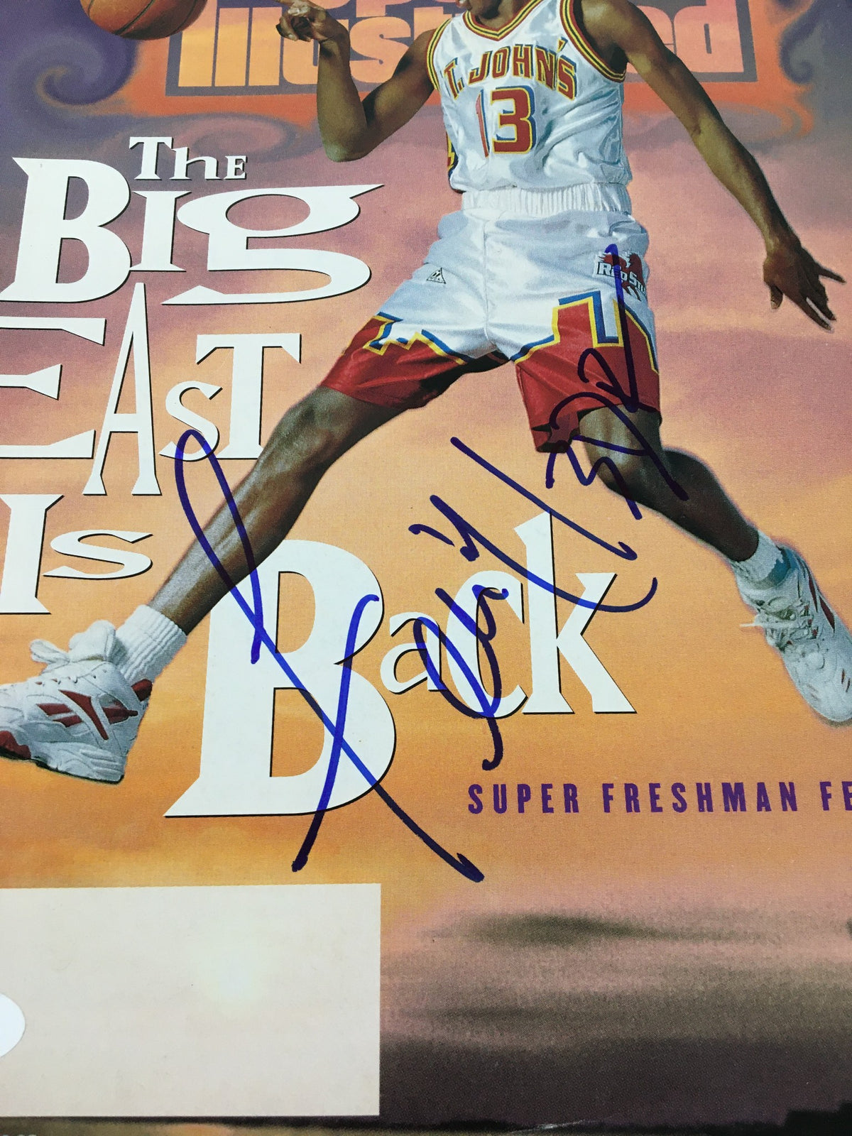 Close-up of the Felipe Lopez Sports Illustrated magazine cover from November 28, 1994, highlighting his autograph and the 'The Big East Is Back' headline.