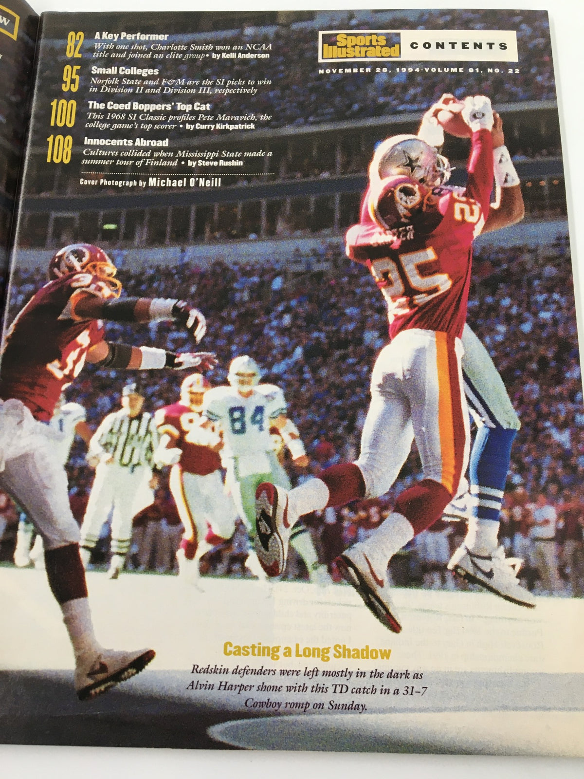 Contents page of Felipe Lopez Sports Illustrated from November 28, 1994, highlighting key sections such as 'A Key Performer', 'Small Colleges', and 'The Coed Bloopers' Top Cat', along with an action shot of a football game.