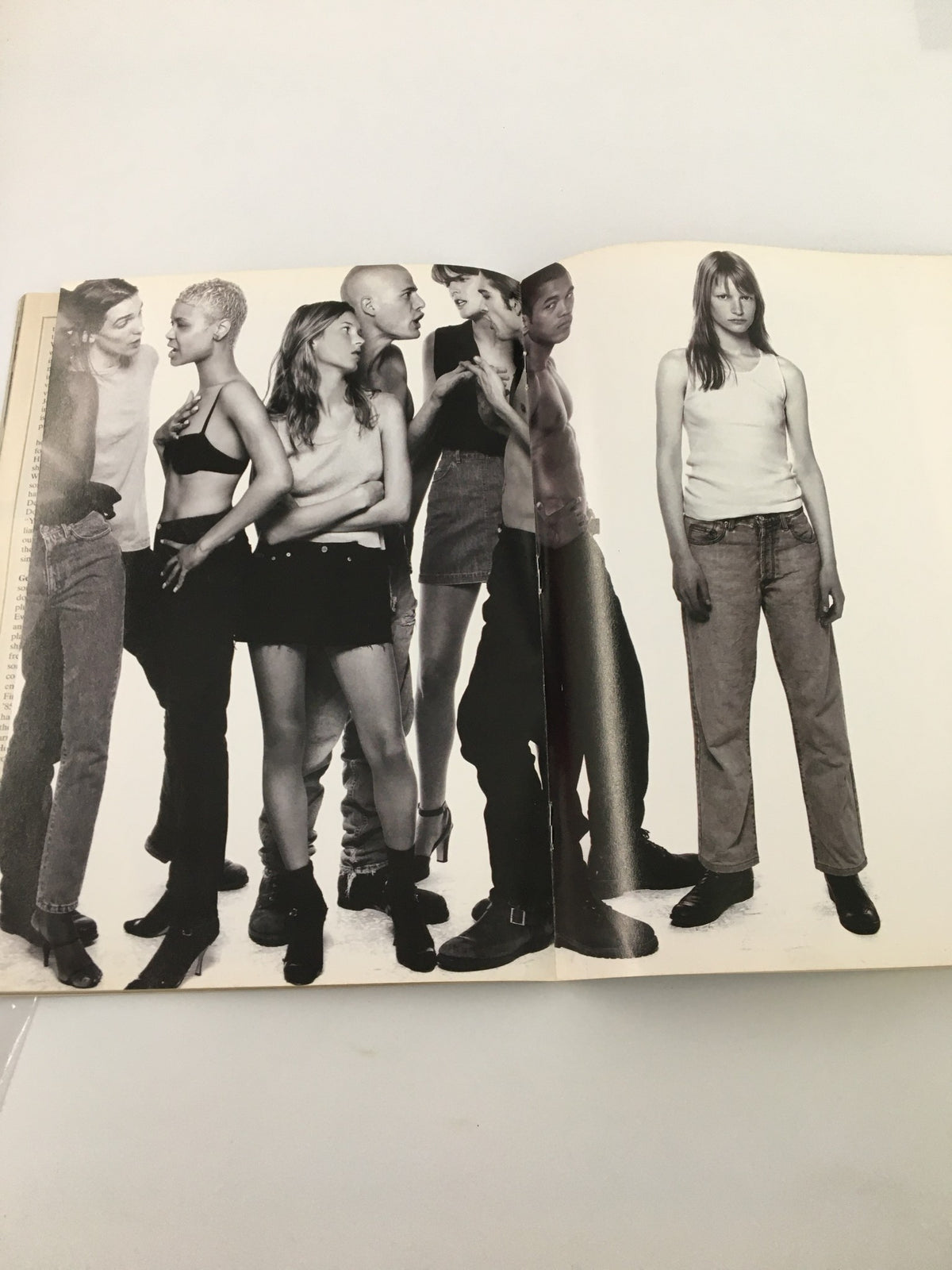Black and white photograph of diverse models posing together, showcasing unique styles and expressions, in a layout that emphasizes trends and fashion featured in Felipe Lopez Sports Illustrated November 28, 1994.