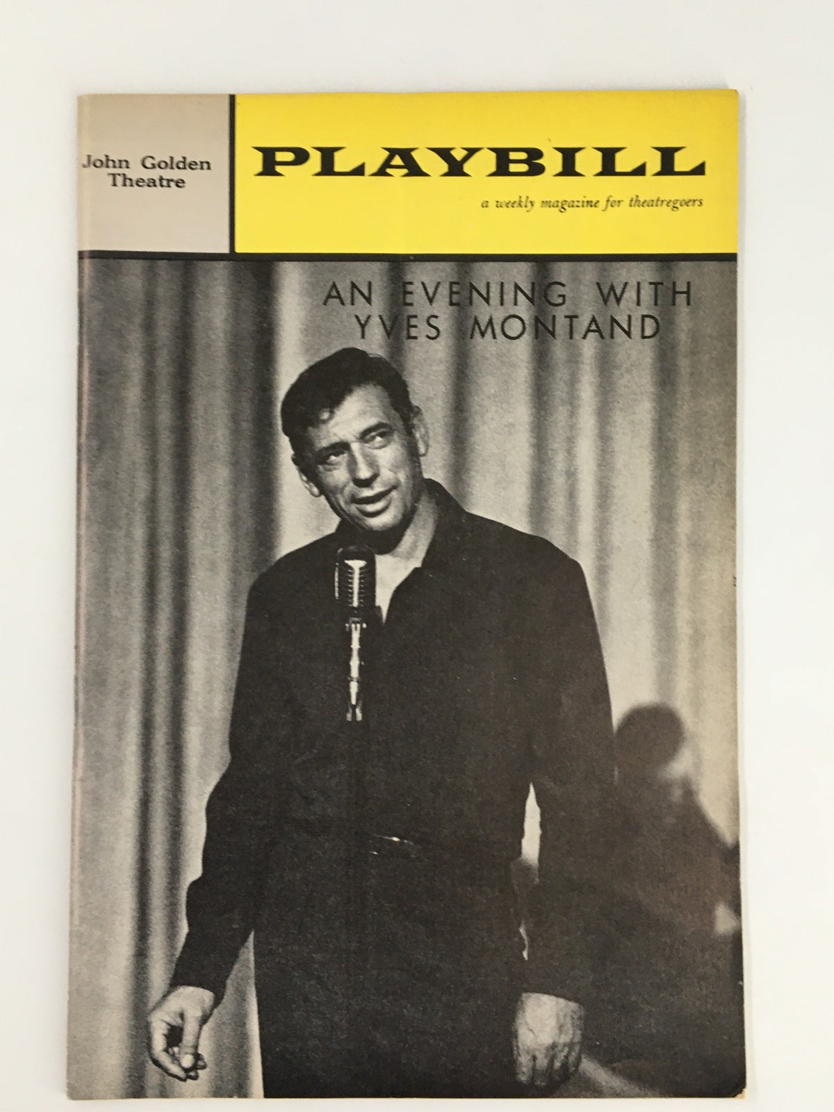 1961 Playbill for 'An Evening with Yves Montand' at John Golden Theatre featuring a monochrome image of Yves Montand performing with a microphone.