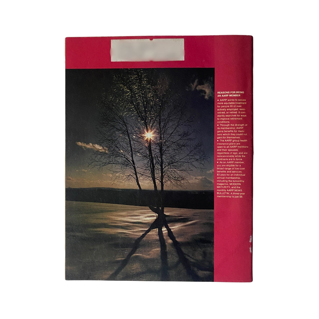 Back cover of VTG Modern Maturity Magazine December 1976 with a photograph of a tree under a glowing sun, emphasizing the nostalgia of the 'Christmas in Our Lifetime' theme.